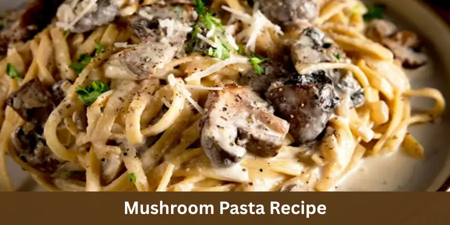 A bowl of finished Mushroom Pasta with creamy sauce and savory mushrooms on a neutral surface, served with a fork and simple linen.