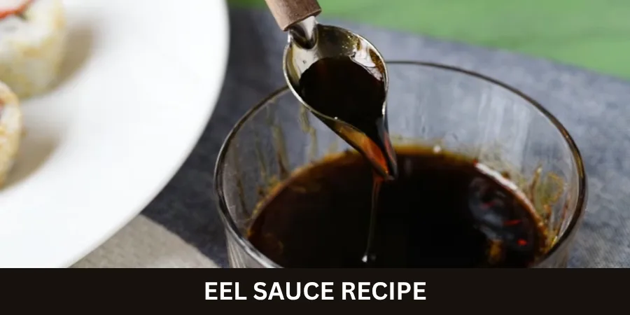 A bowl of smooth homemade eel sauce sits on a neutral kitchen counter with a simple spoon beside it.